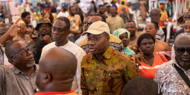 Mahama Ayariga Pledges Push to Complete Kejetia Phase II after Inspection 1 Ayariga speaks with traders inside the market during his visit, part of his engagement with stakeholders affected by the project's delays.