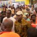 Ayariga speaks with traders inside the market during his visit, part of his engagement with stakeholders affected by the project's delays.