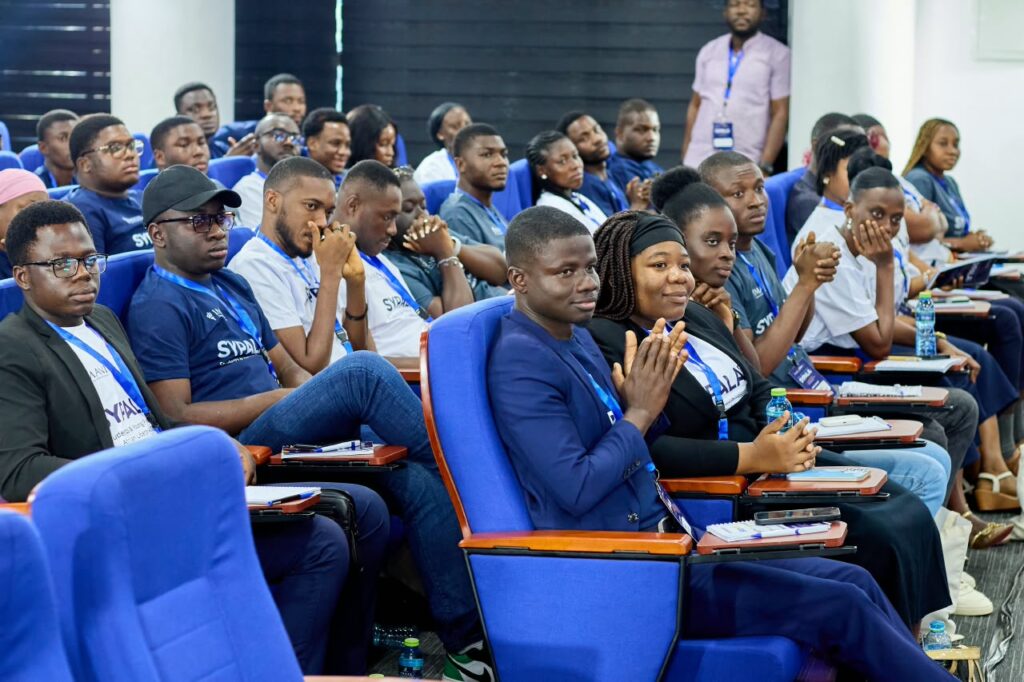 Students and young professionals at SYPALA 2026 listen and applaud during Hosi's closing session on the last day of the four-day academy.