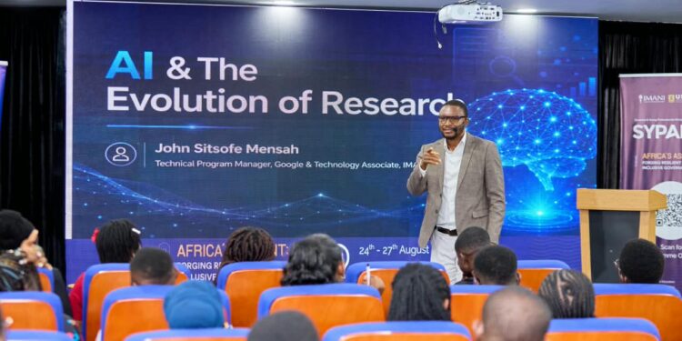 IMANI's Sitsofe Mensah Warns Funding Gap Could Derail AU AI Targets 1 John Sitsofe Mensah, Technical Program Manager at Google and Technology Associate at IMANI CPE, addresses participants on "AI & The Evolution of Research" at SYPALA 2026