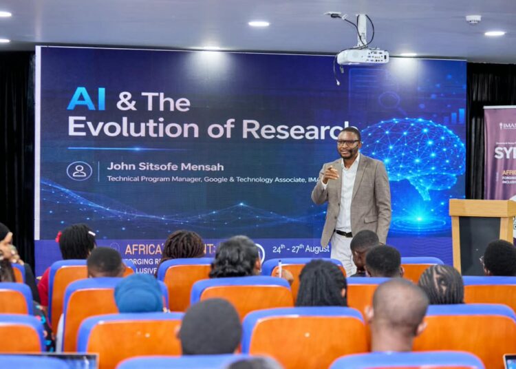 IMANI's Sitsofe Mensah Warns Funding Gap Could Derail AU AI Targets 1 John Sitsofe Mensah, Technical Program Manager at Google and Technology Associate at IMANI CPE, addresses participants on "AI & The Evolution of Research" at SYPALA 2026