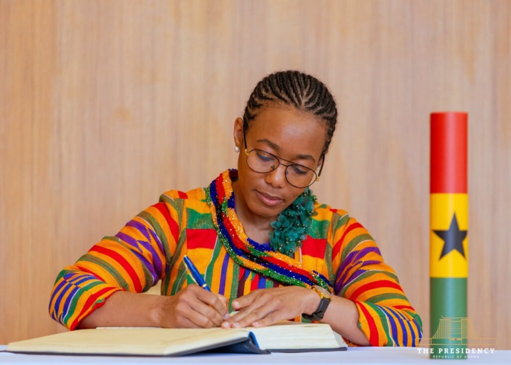 Dr Zanetor Agyeman-Rawlings signs the Oath of Allegiance at Jubilee House on Saturday before assuming office as Minister of State. Photo: The Presidency