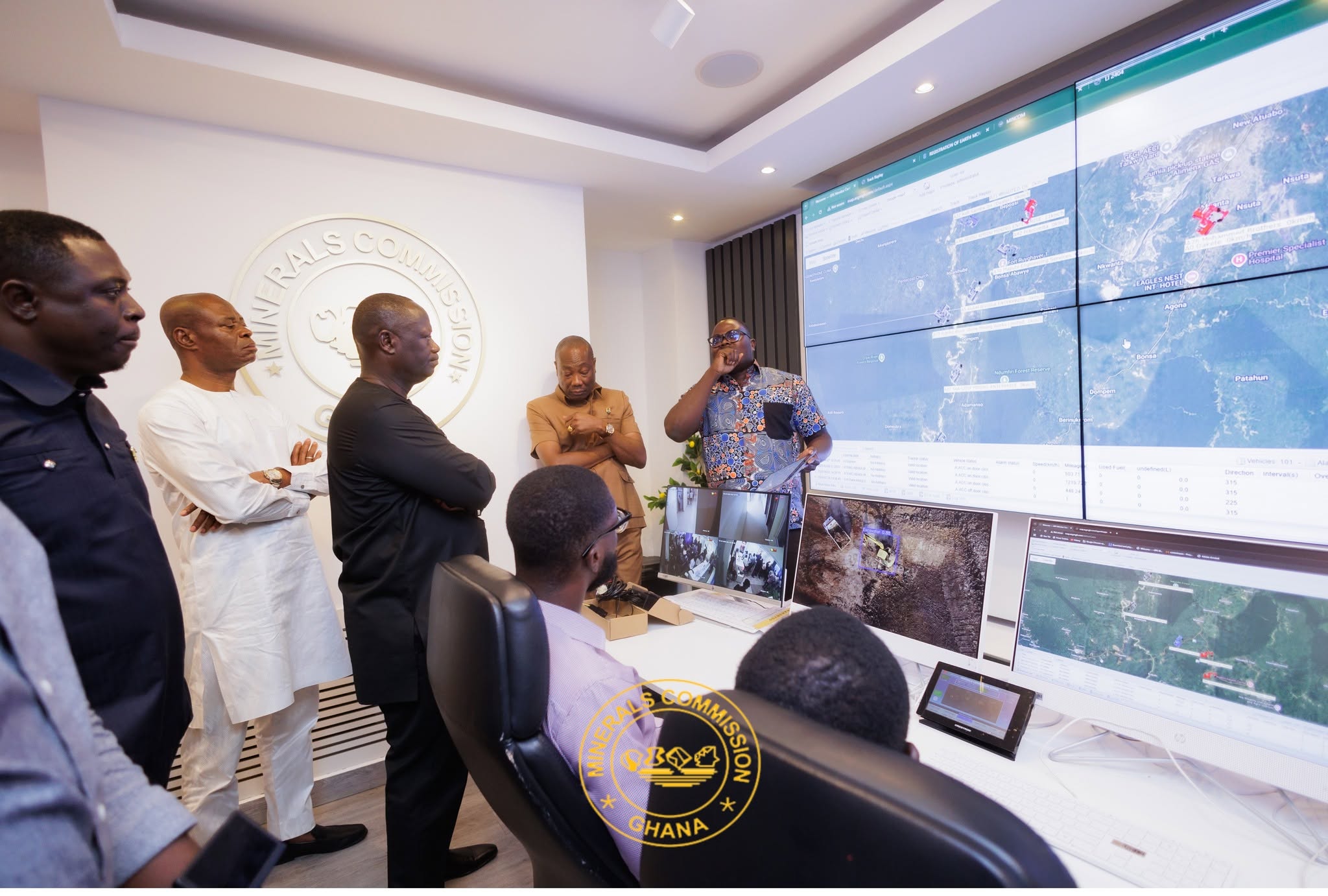 Dr. Sylvester Akpah explaining the new technology to the minister of lands