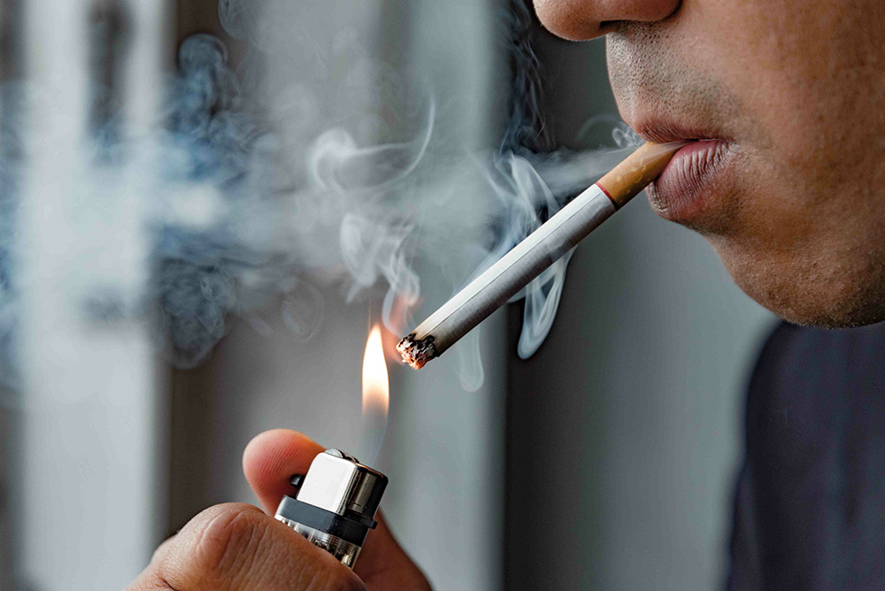 WHO Warns Smoking Raises Infertility Risk 3 A man smoking cigarette