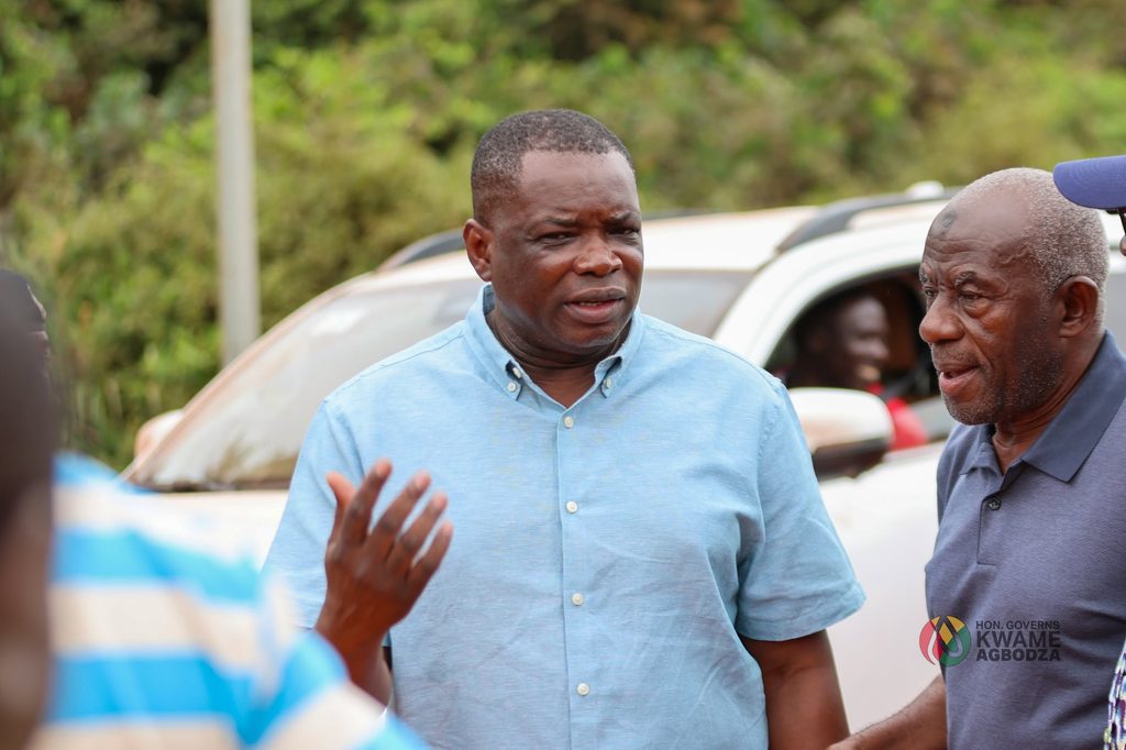 Roads and Highways Minister Kwame Governs Agbodza and his team engage stakeholders at a project site during the Big Push inspection tour in the Western North Region.