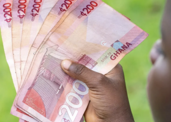 A Ghanaian holding notes