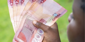 A Ghanaian holding notes