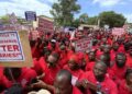 Coalition of Unpaid Teachers, demostrating