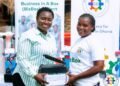 GEA Supports 133 Young Entrepreneurs in Sekyere Kumawu District with BizBox 7 GEA CEO Miss Margaret Ansei Presenting a Start-Up Kit to a Beneficiatry