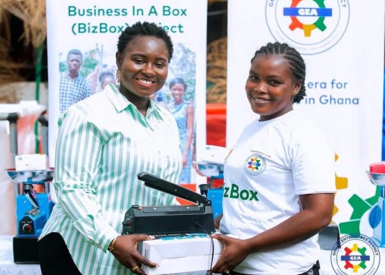 GEA CEO Miss Margaret Ansei Presenting a Start-Up Kit to a Beneficiatry