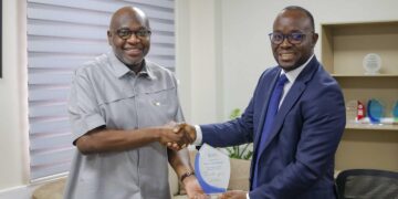Dr. Ransford Abbey, CEO of COCOBOD, in a Handshake with Mr. Korse Godzi, CEO of Standard Chartered Bank , After a Working Visit to the Cocoa House to Strengthen Partnership on Cocoa Financing
