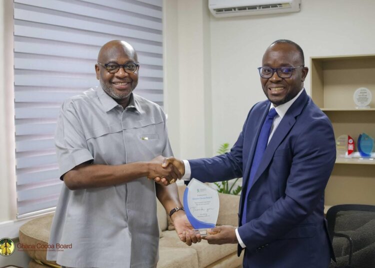 Dr. Ransford Abbey, CEO of COCOBOD, in a Handshake with Mr. Korse Godzi, CEO of Standard Chartered Bank , After a Working Visit to the Cocoa House to Strengthen Partnership on Cocoa Financing