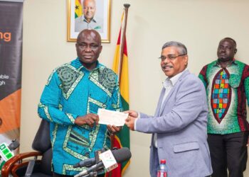 Olam Agri Ghana Supports 42nd National Farmers’ Day with GH¢100,000 3 The Minister for Food and Agriculture, Hon. Eric Opoku Receiving the Cash Prize Support from the Head of Olam Agri Ghana, Mr. Baibhav Biswas