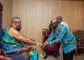 Hon. Eric Opoku Minister for Food and Agriculture at the Ga Mnatse Place Paying Homage to the Stool while Engaging on Maize Production Demand