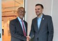 Chief Executive Officer of the Millennium Development Authority (MiDA), Mr. Alex Mould, shaking hands with senior official of the MCC in New York