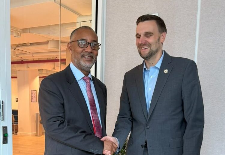 Chief Executive Officer of the Millennium Development Authority (MiDA), Mr. Alex Mould, shaking hands with senior official of the MCC in New York