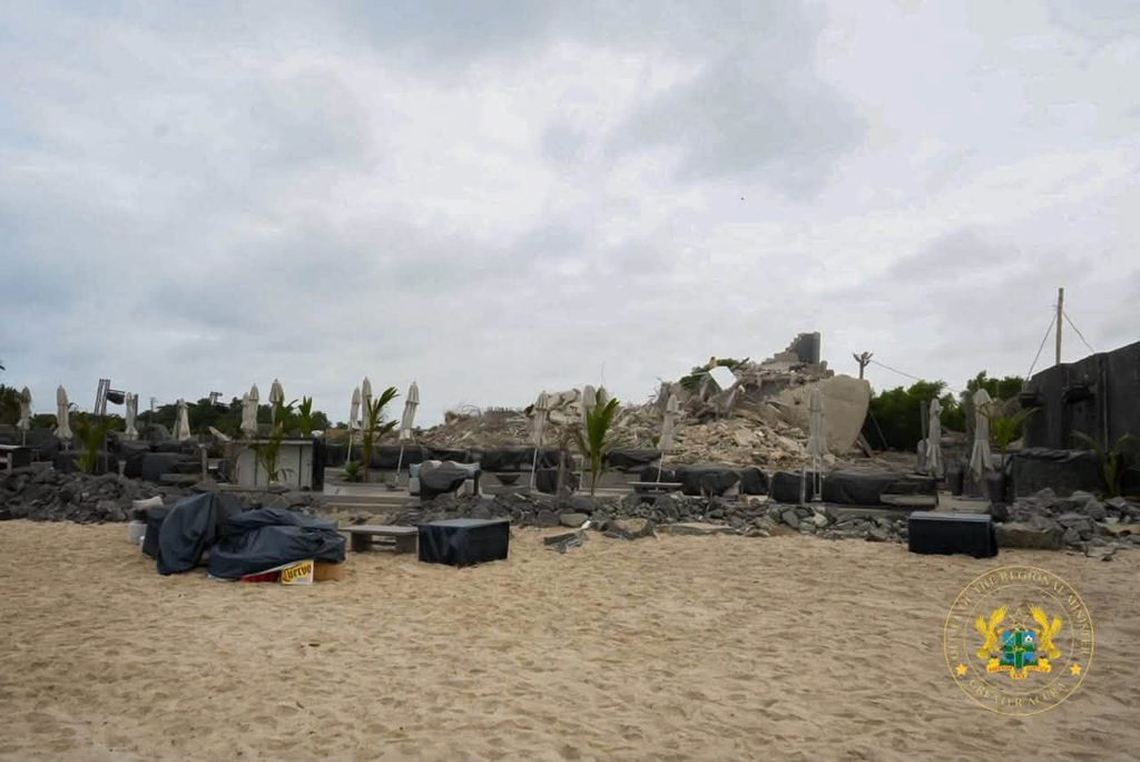 Sunday's Laboma Exercise Was Not a Demolition of the Beach, Stan Dogbe Insists 4 An excavator brings down a beachfront structure at Laboma on Sunday as the Post Flood Mitigation Task Force clears the Kpeshie Lagoon buffer zone.