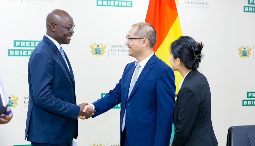 Ghana’s Finance Minister seated with a Chinese official during the Ghana–China Joint Commission meeting.