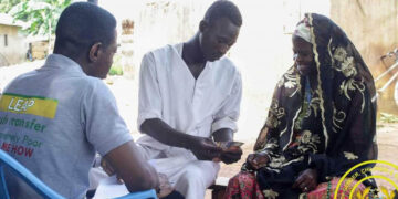 LEAP beneficiary receiving cash transfer support in Ghana