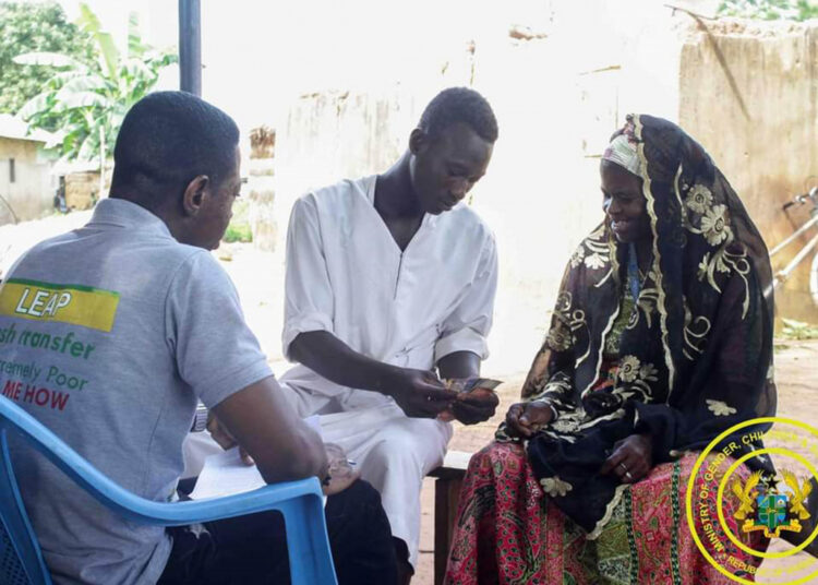 LEAP Expansion Tests Ghana’s Social Protection Budget 1 LEAP beneficiary receiving cash transfer support in Ghana