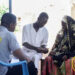 LEAP beneficiary receiving cash transfer support in Ghana