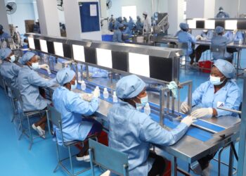 Workers on a pharmaceutical production line in Ghana
