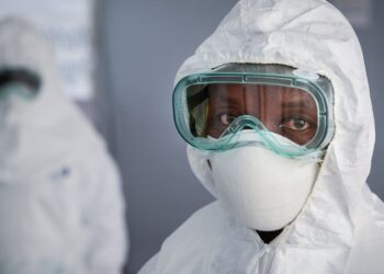 A healthcare worker wearing full personal protective equipment (PPE)
