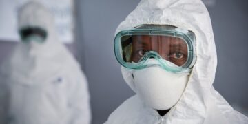 A healthcare worker wearing full personal protective equipment (PPE)
