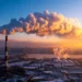 Industrial smoke and greenhouse gas emissions rising from a factory