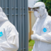 Nigerian Lawmakers Call for Action After Abuja Ebola Case 14 Health professionals in protective suits during a public health response
