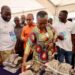 Hon. Emelia Arthur, Minister for Fisheries and Aquaculture Inspecting Fish Products at the Ceremony