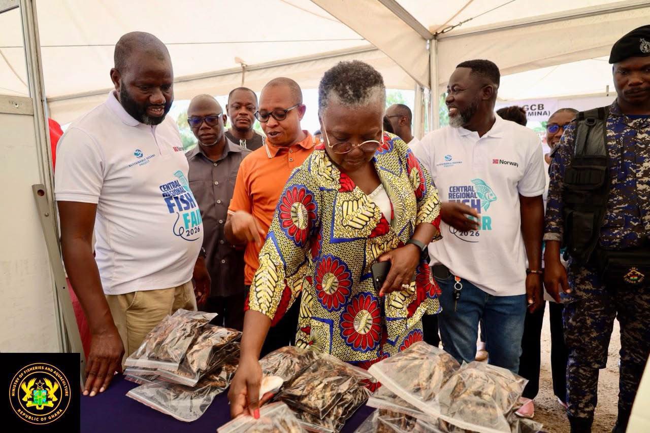 Hon. Emelia Arthur, Minister for Fisheries and Aquaculture Inspecting Fish Products at the Ceremony