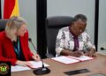 The Minister for Fisheries and Aquaculture, Hon. Emelia Arthur Signing the MoU ON Ghana.