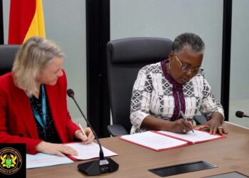 The Minister for Fisheries and Aquaculture, Hon. Emelia Arthur Signing the MoU ON Ghana.