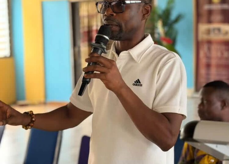 A Facilitator Engaging Cocoa Framers in the Volta and Oti Region About the New Cocoa Reforms