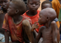 War-Torn Sudan Faces Growing Famine Threat From Drought 6 Displaced children gathered at an internally displaced person (IDP) camp