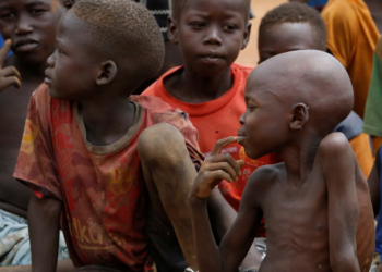 War-Torn Sudan Faces Growing Famine Threat From Drought 3 Displaced children gathered at an internally displaced person (IDP) camp
