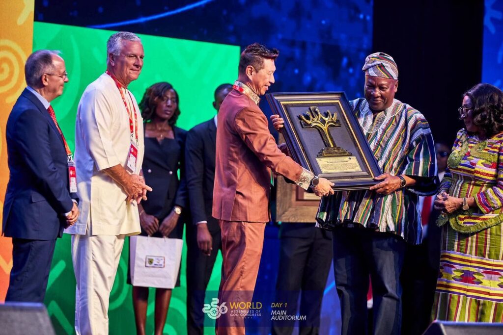 Assemblies of God Global Honours Mahama, Lordina with Trailblazer Award 4 President Mahama receives the Global Leadership Excellence and Trailblazer Award from a World Assemblies of God Fellowship leader during the opening session of the congress in Accra.