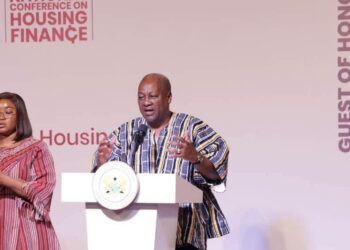 Mahama Targets Ghana's 1.8 Million Unit Housing Deficit 2 President John Dramani Mahama addresses delegates at the National Conference on Housing Finance on October 7, 2026, where he announced a GH¢1 billion budget allocation to the National Housing Fund. A sign language interpreter stands beside him.