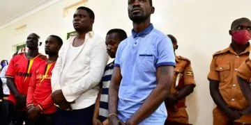 Ugandan presidential candidate Robert Kyagulanyi also known as Bobi Wine stands inside the courtroom in Iganga, eastern Uganda. Image: REUTERS