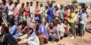 Ethiopian refugees fleeing fighting in Tigray province queue to receive supplies at the Um Rakuba camp in Sudan's eastern Gedaref province, on November 16. Image: AFP