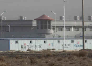China decries planned UN event on Xinjiang, describes as insult 3 A guard tower and barbed wire fences around a facility in Artux in western China's Xinjiang region