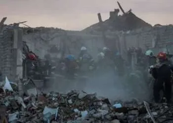 Rescuers work at a site of a Russian military strike in the village of Hroza, in Kharkiv region, Ukraine.