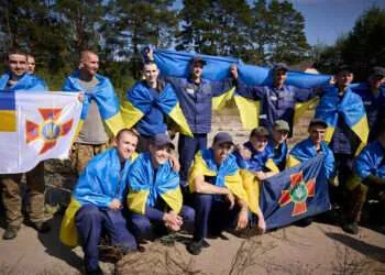 Russia And Ukraine Exchange 206 Prisoners Of War 3 This handout photograph taken and released by the Ukrainian Presidential Press Service on September 14, 2024 shows Ukrainian prisoners of war (POWs) posing for a photo following a swap at an undisclosed location in Ukraine.
