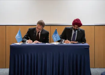 Rafael Mariano Grossi, Director General of the International Atomic Energy Agency, and Ajay Banga, President of the World Bank Group, sign a partnership agreement