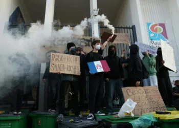 Pupils in France blocked the entrance to their school.