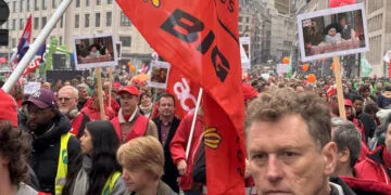 People march with signs during a general strike in Brussels, 14 October, 2025.